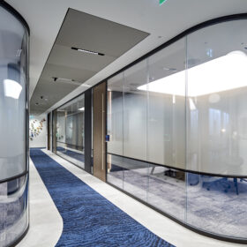 Project: International Finance Services Firm | Products: Revolution 54 Plus Shoreditch Edition bespoke curved glass partitions with Timber doors