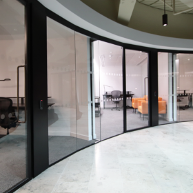 Project: Warner Bros | Products: Optima 117 Plus glass partitions with Edge Symmetry door & 3D Tech Panel