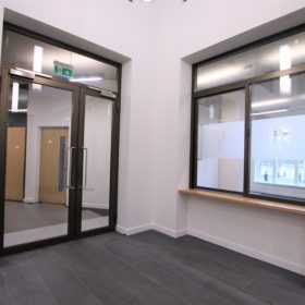 Project: St Hilda's College | Products: Elite Aero pocket sliding door & Technishield 50 non-fire rated leaf and half doors set with over panel