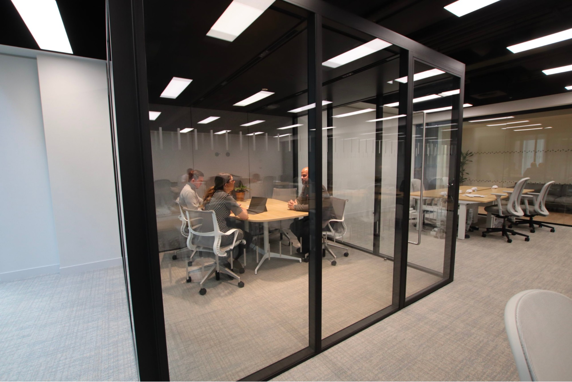 modular glass walls creating an individual coworking space 