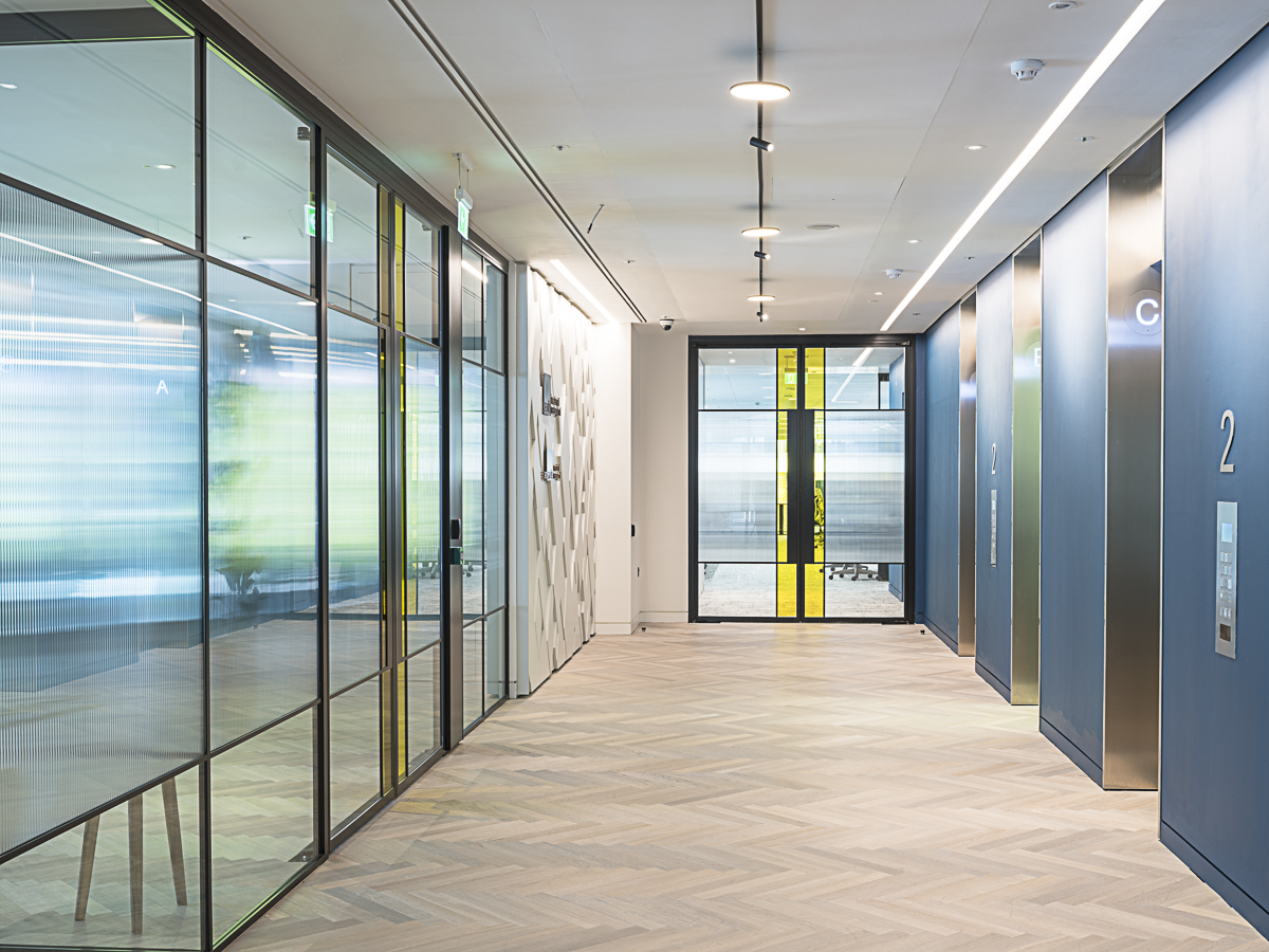 A glass office partition being used at KKS Savills Headquarters in London