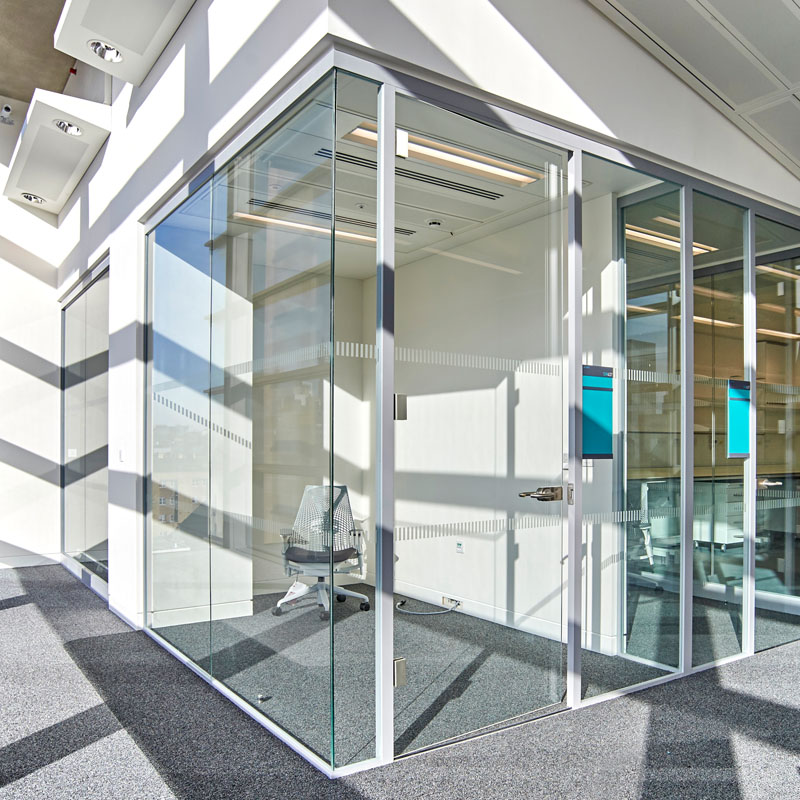 an image of modern glass doors being used for cubicles