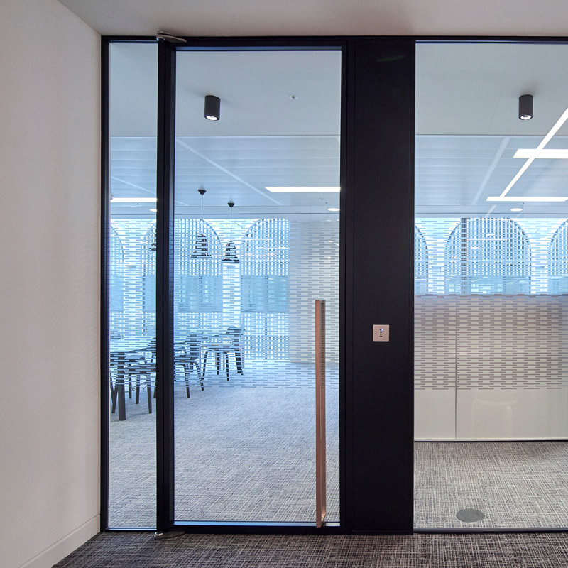 an office space with glass doors