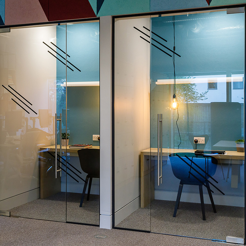 an image of an privacy pods created out of office glass doors