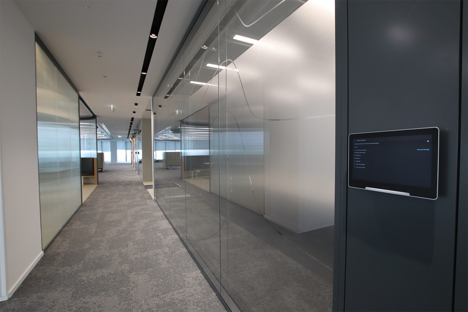 A wall replaced with glass office partitions