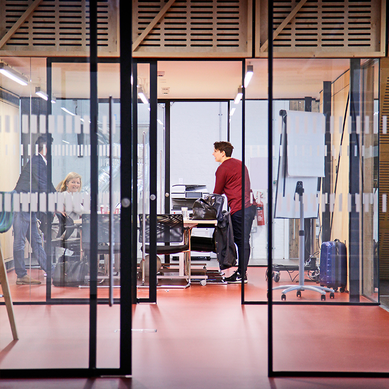 an image of two types of door frames with black frames in an office