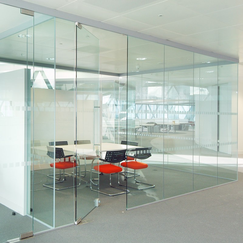 an image of a conference room table surrounded by glass partition walls
